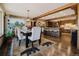 Stylish dining area open to the kitchen features mountain views and a decorative rug at 351 N Saddle Dr, Idaho Springs, CO 80452