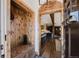 Inviting foyer with wood accents, a built-in bench, and a view into the open-concept living space at 351 N Saddle Dr, Idaho Springs, CO 80452
