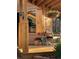 Welcoming front porch with a bench, decorative accents, and a view of lush greenery at 351 N Saddle Dr, Idaho Springs, CO 80452