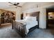 Primary bedroom with a large bed, built-in bookshelves, and ample natural light, creating a serene retreat at 351 N Saddle Dr, Idaho Springs, CO 80452