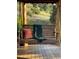 Relaxing porch swing with a soft cushion and a blanket overlooking the peaceful scenery at 351 N Saddle Dr, Idaho Springs, CO 80452
