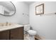 Bright bathroom with a stylish vanity, round mirror, and updated fixtures at 444 17Th St # 603, Denver, CO 80202