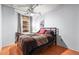 Cozy bedroom with a comfortable bed, ceiling fan, and natural light from the window at 444 17Th St # 603, Denver, CO 80202