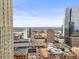 Breathtaking cityscape view featuring Denver signage and distant mountain peaks at 444 17Th St # 603, Denver, CO 80202