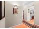 Hallway view showcasing hardwood floors, kitchen entrance, and decorative wall art at 444 17Th St # 603, Denver, CO 80202