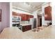 Modern kitchen featuring stainless steel appliances, dark wood cabinets, and granite countertops at 444 17Th St # 603, Denver, CO 80202