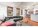 Modern living room featuring hardwood floors, a comfortable gray couch, and exposed concrete ceilings at 444 17Th St # 603, Denver, CO 80202