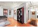 Spacious condo featuring hardwood floors, a bookshelf, exposed ceilings, and a glimpse of the kitchen at 444 17Th St # 603, Denver, CO 80202