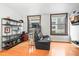Comfortable office area with shelves, seating, and city views from the windows at 444 17Th St # 603, Denver, CO 80202