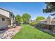 Spacious backyard featuring a patio with outdoor dining set, lush lawn, and lovely landscaping, ideal for outdoor living at 13266 Canopus Dr, Lone Tree, CO 80124