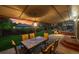 Cozy covered patio with dining set and gas grill provides a relaxing outdoor entertainment area at 13266 Canopus Dr, Lone Tree, CO 80124