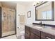 Modern bathroom with a granite vanity, walk-in shower, and updated fixtures at 13266 Canopus Dr, Lone Tree, CO 80124