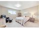 Cozy bedroom with neutral colors, a window with view, and soft carpet at 13266 Canopus Dr, Lone Tree, CO 80124