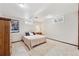 Cozy bedroom features neutral carpet, ample light from egress windows and closet for storage at 13266 Canopus Dr, Lone Tree, CO 80124