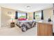 Comfortable bedroom with natural light, soft carpet, and neutral decor at 13266 Canopus Dr, Lone Tree, CO 80124