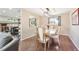 Cozy dining room featuring hardwood floors, a stylish chandelier, and a bright window at 13266 Canopus Dr, Lone Tree, CO 80124