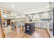 Charming kitchen with modern appliances, center island, and open access to the living area at 13266 Canopus Dr, Lone Tree, CO 80124