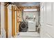 Unfinished laundry area with washer, dryer and exposed overhead piping; storage solutions in view at 13266 Canopus Dr, Lone Tree, CO 80124