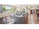 Bright living room with large windows, stylish furniture, and hardwood floors, perfect for entertaining at 13266 Canopus Dr, Lone Tree, CO 80124
