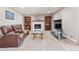 Comfortable living room with a fireplace, built-in bookshelves, and a soft carpet at 13266 Canopus Dr, Lone Tree, CO 80124