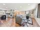 Open-concept living space with hardwood floors, modern kitchen, and comfortable living area at 13266 Canopus Dr, Lone Tree, CO 80124