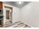 Dining area features view of the kitchen and carpeted bedroom space at 5875 E Iliff Ave # 115, Denver, CO 80222