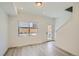 Bright and airy living room with door to backyard at 15275 W 68Th Pl, Arvada, CO 80007