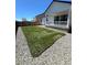 Newly sodded backyard is landscaped with gravel, offering a serene space for outdoor activities and relaxation at 180 N Edge Cliff St, Castle Rock, CO 80104
