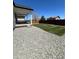 Landscaped backyard with gravel surround and freshly laid sod with a covered porch, making it an ideal outdoor space at 180 N Edge Cliff St, Castle Rock, CO 80104
