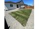 An expansive backyard features sod, gravel, and outdoor living for relaxation and enjoyment in a peaceful setting at 180 N Edge Cliff St, Castle Rock, CO 80104