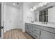 Elegant bathroom with double vanity, modern fixtures, and a walk-in glass shower at 180 N Edge Cliff St, Castle Rock, CO 80104
