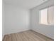 Neutral bedroom features wood-look flooring and a window at 180 N Edge Cliff St, Castle Rock, CO 80104