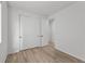Bright bedroom features wood floors, closet and natural light from the window at 180 N Edge Cliff St, Castle Rock, CO 80104
