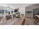 Bright dining area featuring modern chandelier and view of kitchen and living room area at 180 N Edge Cliff St, Castle Rock, CO 80104