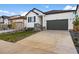 Charming two-story home with well-manicured front yard and driveway at 180 N Edge Cliff St, Castle Rock, CO 80104