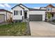 Charming single-Gathering home featuring a modern exterior with a two-car garage and well-maintained front yard at 180 N Edge Cliff St, Castle Rock, CO 80104