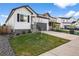 Charming two-story home with well-manicured front yard and driveway at 180 N Edge Cliff St, Castle Rock, CO 80104