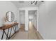Inviting hallway with stylish decor, light wood floors, and views into other rooms at 180 N Edge Cliff St, Castle Rock, CO 80104