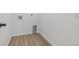 Utility room with hookups and wood-look flooring at 180 N Edge Cliff St, Castle Rock, CO 80104