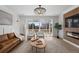 Bright living room with large windows, stylish furniture, and a modern fireplace feature at 180 N Edge Cliff St, Castle Rock, CO 80104