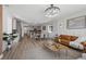Inviting living space showcasing an open layout, elegant lighting, and seamless flow to the kitchen and dining areas at 180 N Edge Cliff St, Castle Rock, CO 80104