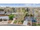 Aerial view of neighborhood showcasing home's placement among mature trees at 5481 E Tennessee Ave, Denver, CO 80246