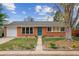Charming brick home with mature tree, lawn and garden beds at 5481 E Tennessee Ave, Denver, CO 80246