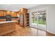 Updated kitchen includes stainless appliances and opens to backyard with patio access at 5481 E Tennessee Ave, Denver, CO 80246