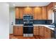 Updated kitchen with stainless steel appliances and patterned backsplash at 5481 E Tennessee Ave, Denver, CO 80246