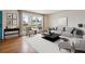 Stylishly furnished living room with a large window, hardwood floors, and contemporary decor at 5481 E Tennessee Ave, Denver, CO 80246