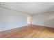 Empty living room featuring hardwood floors and neutral paint, offering a blank canvas for personalization at 5481 E Tennessee Ave, Denver, CO 80246