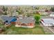 Aerial view of the rear exterior of the property, featuring a patio and fenced backyard at 5481 E Tennessee Ave, Denver, CO 80246