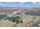 Scenic aerial view featuring neighborhood homes, parks, ponds, and distant plains, showcasing a vibrant community setting at 10733 Salida St, Commerce City, CO 80022