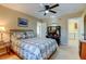 Charming bedroom showcases a built-in desk and easy access to a well-equipped laundry area for convenience at 10733 Salida St, Commerce City, CO 80022